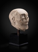 A carved limestone head of a fasting Luohan Song dynasty | 宋 石灰石雕羅漢首像