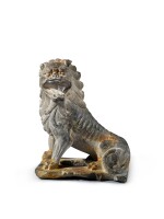A carved limestone figure of a lion, Tang dynasty | 唐 石灰石雕坐獅