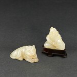 A WHITE JADE FIGURE OF A TIGER AND A WHITE JADE 'BOY AND DRUM' GROUP QING DYNASTY | 清 白玉臥虎及擊鼓童子一組兩件