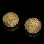A pair of parcel-gilt silver foliate-form 'phoenix' boxes and covers, Tang dynasty | 唐 銀局部鎏金鳳紋菱花式蓋盒一對
