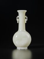 A white jade vase, 19th / 20th century | 十九 / 二十世紀 白玉雕雙耳活環長頸瓶