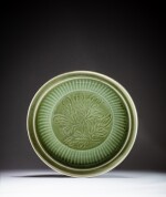 A flutted 'Longquan' celadon-glazed 'flower' charger, Yuan dynasty | 元 龍泉窰青釉花卉紋折沿大盤