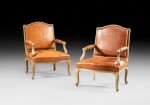 A pair of re-lacquered armchairs, Louis XV, circa 1730 | Paire de fauteuils en bois relaqué crème d'époque Louis XV, vers 1730
