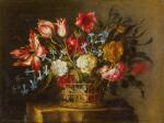 JUAN DE ARELLANO | Still life of tulips, bluebells and other flowers in a basket on a stone pedestal