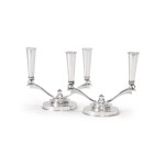 TWO MATCHING DANISH SILVER TWO-LIGHT CANDELABRA, NO. 630A, DESIGNED BY HARALD NIELSEN, GEORG JENSEN SILVERSMITHY, COPENHAGEN, CIRCA 1933-44 AND 1945-77