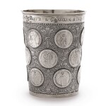 A GERMAN PARCEL-GILT SILVER AND COIN-INSET BEAKER, MAKER'S MARK FW, PROBABLY PRUSSIA, DATED 1713