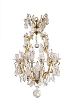 A Louis XV style gilt-brass and rock-crystal eight light chandelier, part 18th century