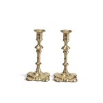 A Pair of English Cast-Brass Petal-Base Candlesticks, probably by George Grove, circa 1750
