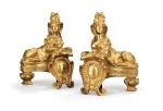 A pair of French gilt-bronze chenets in Regence style, late 19th century