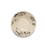 A fragmentary Nishapur calligraphic pottery bowl, Persia, 10th century
