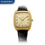 REFERENCE R3003 A YELLOW GOLD TONNEAU SHAPED WRISTWATCH WITH DATE, CIRCA 1970