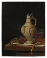 Still life with an earthenware jug, tortoise shell tobacco box, 'gouda' pipe, glass of beer, and tobacco smoking implements