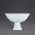 A white anhua-decorated 'bajixiang' stem bowl, Mark and period of Yongzheng | 清雍正 白釉暗花八吉祥高足盌 《大清雍正年製》款