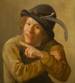 JAN MIENSE MOLENAER | A SMILING YOUTH WEARING A BLACK HAT WITH A FEATHER AND A CLAY PIPE IN THE BRIM