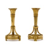 A pair of Louis XVI gilt-bronze candlesticks, the design attributed to Jean-Louis Prieur, late 18th century