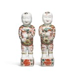 A pair of famille-verte 'laughing boy' figures, Qing dynasty, Kangxi period