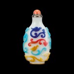 A four-colour overlay white glass 'dragon' snuff bottle Qing dynasty, 18th - 19th century | 清十八至十九世紀 涅白地套四色龍紋鼻煙壺
