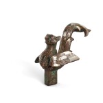 A silver-inlaid bronze 'bird' staff finial, Eastern Zhou dynasty 東周 銅錯銀鳥形杖首