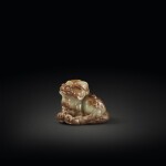 A celadon and russet jade figure of a mythical beast, Qing dynasty | 清 玉雕瑞獸擺件