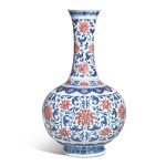 A FINE AND EXCEPTIONALLY RARE UNDERGLAZE-BLUE AND COPPER-RED 'LOTUS' BOTTLE VASE,  QIANLONG SEAL MARK AND PERIOD