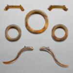 A set of three agate rings and four agate dragon pendants, huang and xi, Eastern Zhou dynasty, Warring States period | 東周戰國 瑪瑙環璜衝牙組珮
