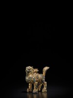 A gilt-bronze lion-form incense holder, Tang Dynasty | 唐 銅鎏金瑞獅形香插