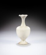 A ‘Ding’ white-glazed foliate-rim vase, Five dynasties - Song dynasty, 9th - 10th century | 五代至宋 九至十世紀 定窰白釉花口瓶