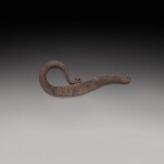 A bronze flat hook and an engraved steel vice, India, 19th century