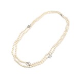CHANEL | IVORY FAUX PEARL DOUBLE STRAND NECKLACE WITH FAUX PEARL EMBELLISHED CC PENDANTS AND LOBSTER CLASP CLOSURE, 2012