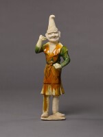 A large sancai-glazed pottery figure of a foreign groom, Tang dynasty | 唐 三彩胡人陶俑