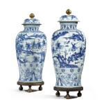 An impressive pair of blue and white 'soldier' vases and covers, Qing dynasty, Kangxi period | 清康熙 青花通景巡狩圖大蓋罐一對