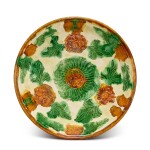 A moulded sancai 'floral' dish, Liao dynasty 遼 三彩印花盤