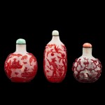 Three red overlay glass snuff bottles, Qing dynasty, 18th - 19th century | 清十八至十九世紀 珍珠地套紅料鼻煙壺一組三件
