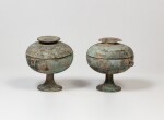 A rare pair of archaic bronze round vessels and covers, dou Warring States period - Han dynasty | 戰國時代至漢 青銅蓋豆一對