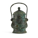 An archaic bronze ritual wine vessel and cover, You, Western Zhou dynasty |  西周 買王卣